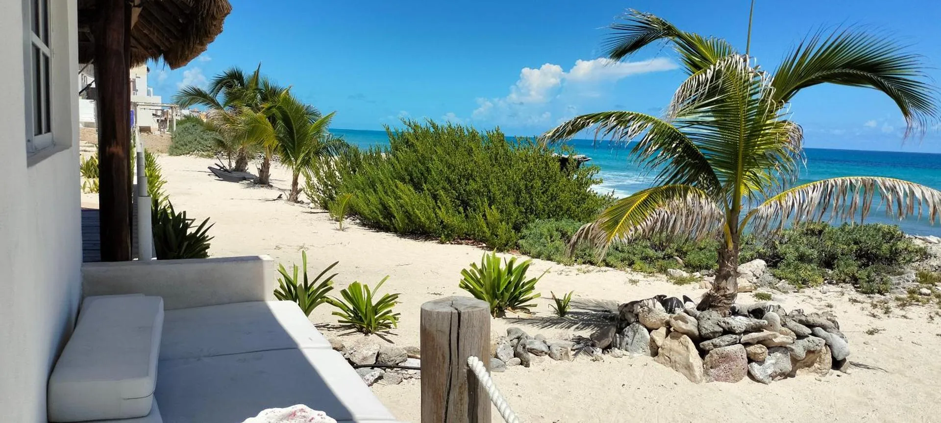 Punta Piedra Studios Isla Mujeres - beachfront property with palm trees